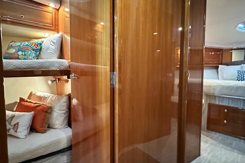 Slide: The Image of Luxurious interior of 2005 Riviera 47 Open Flybridge yacht with cozy bunk beds. - 149