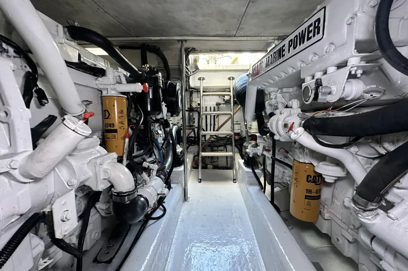 Slide: The Image of Engine room of 2005 Riviera 47 Open Flybridge yacht, showcasing marine power systems. - 150