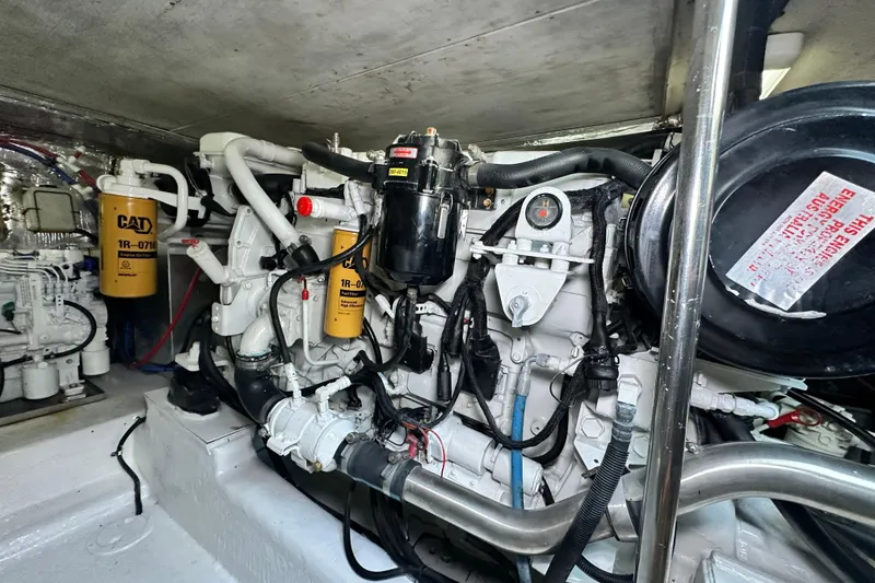 Slide: The Image of Engine room of 2005 Riviera 47 Open Flybridge with CAT components visible. - 151