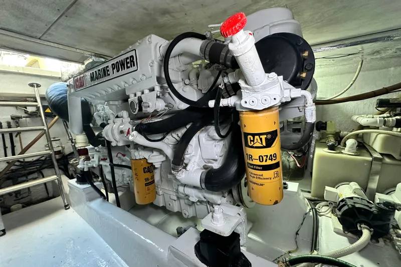 Slide: The Image of Engine room of 2005 Riviera 47 Open Flybridge with CAT Marine Power engine. - 153