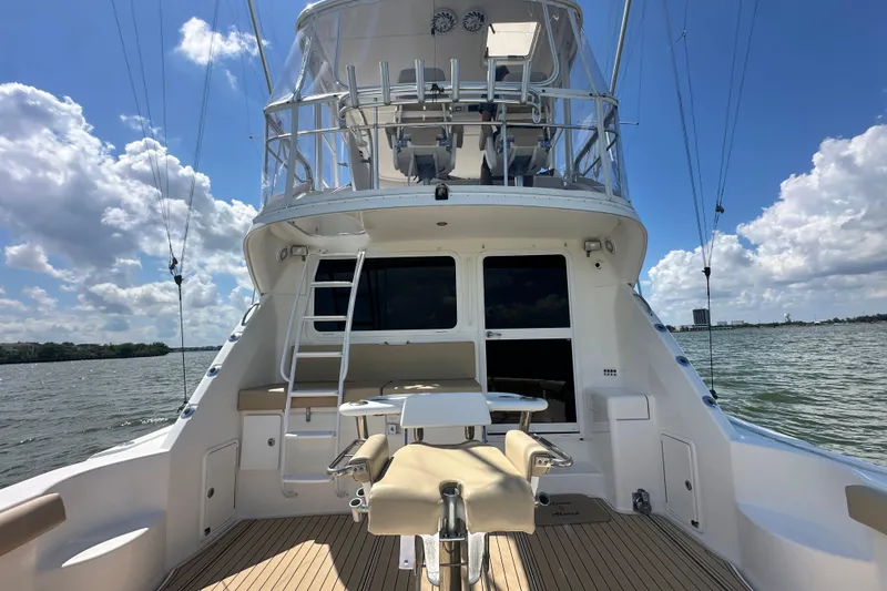 Slide: The Image of 2005 Riviera 47 Open Flybridge yacht with spacious deck and flybridge, on a sunny day. - 18