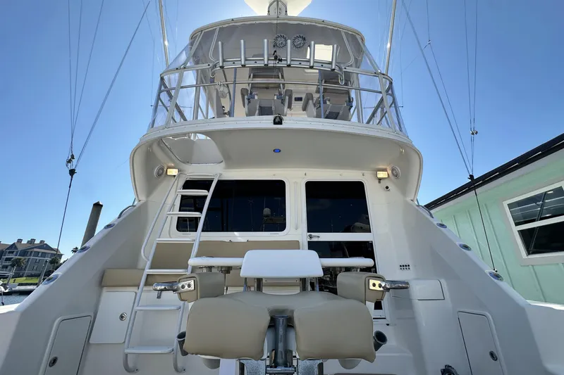 Slide: The Image of 2005 Riviera 47 Open Flybridge yacht, rear view with ladder and seating. - 19