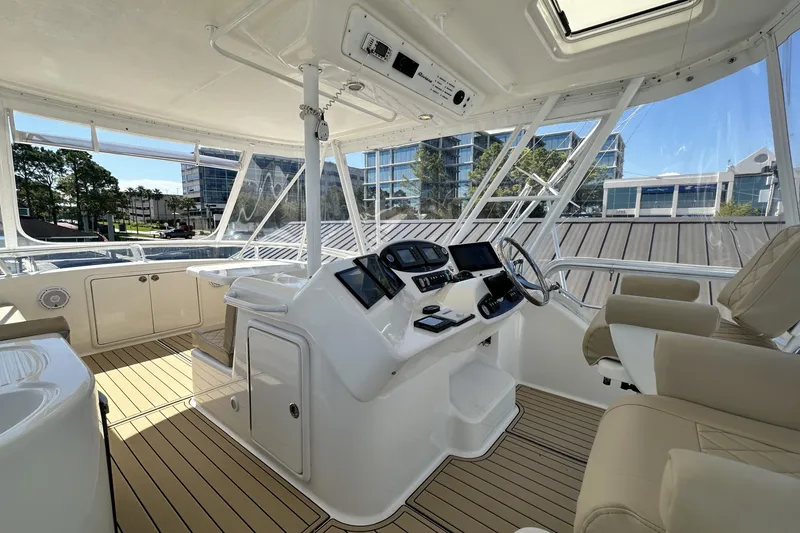 Slide: The Image of Luxurious 2005 Riviera 47 Open Flybridge interior with modern helm and comfortable seating. - 20