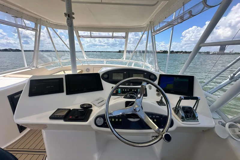 Slide: The Image of Helm of 2005 Riviera 47 Open Flybridge with navigation equipment and ocean view. - 28