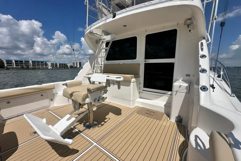 Slide: The Image of 2005 Riviera 47 Open Flybridge yacht deck with fishing chair, ocean view, and modern design. - 39