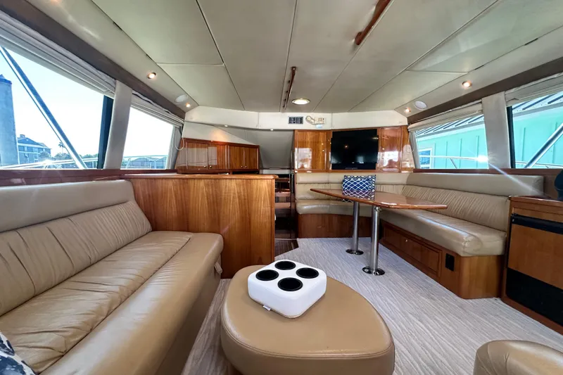 Slide: The Image of Luxurious interior of 2005 Riviera 47 Open Flybridge yacht with leather seating and wood accents. - 65