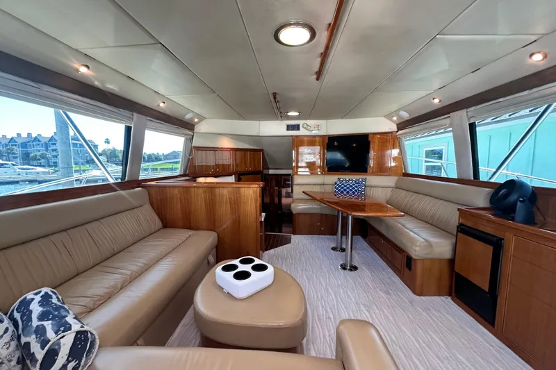 Slide: The Image of Luxurious interior of 2005 Riviera 47 Open Flybridge yacht with leather seating and wood finishes. - 67