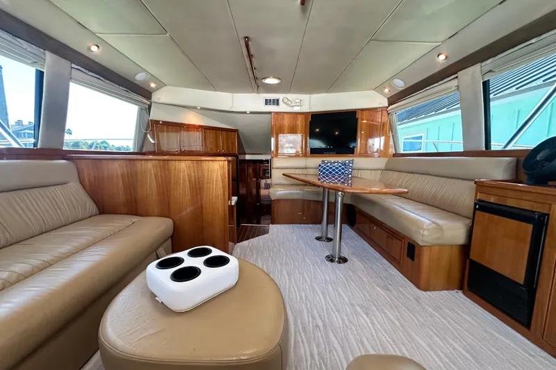 Slide: The Image of Luxurious interior of 2005 Riviera 47 Open Flybridge yacht with leather seating and modern amenities. - 70