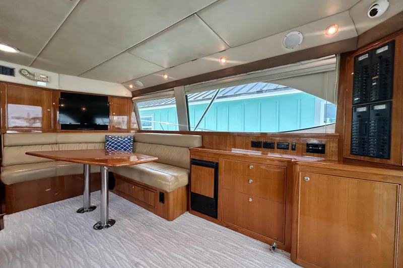 Slide: The Image of Luxurious interior of 2005 Riviera 47 Open Flybridge yacht with elegant wood finishes. - 72