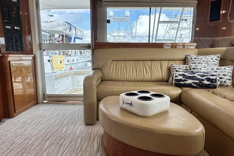 Slide: The Image of Luxurious interior of 2005 Riviera 47 Open Flybridge yacht with leather seating and nautical decor. - 78