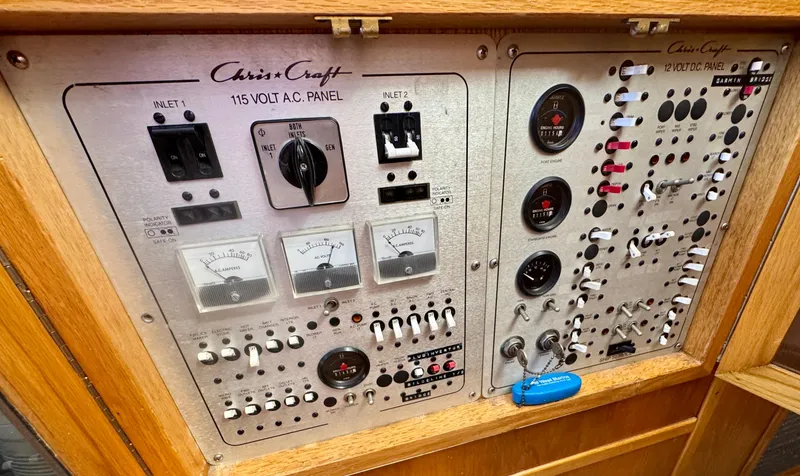 Slide: The Image of 1989 Chris-Craft Catalina control panel with 115V AC and 12V DC systems. - 26