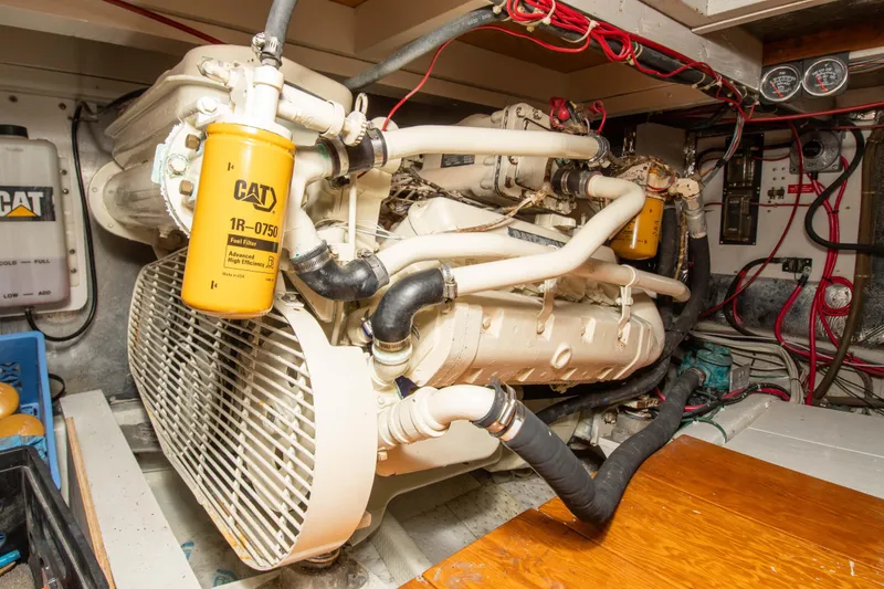 Slide: The Image of Engine room of a 1989 Chris-Craft Catalina boat with CAT components and wiring. - 27
