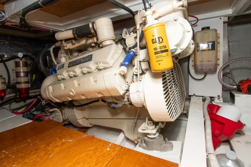 Slide: The Image of Engine room of a 1989 Chris-Craft Catalina boat, featuring a Caterpillar engine. - 29