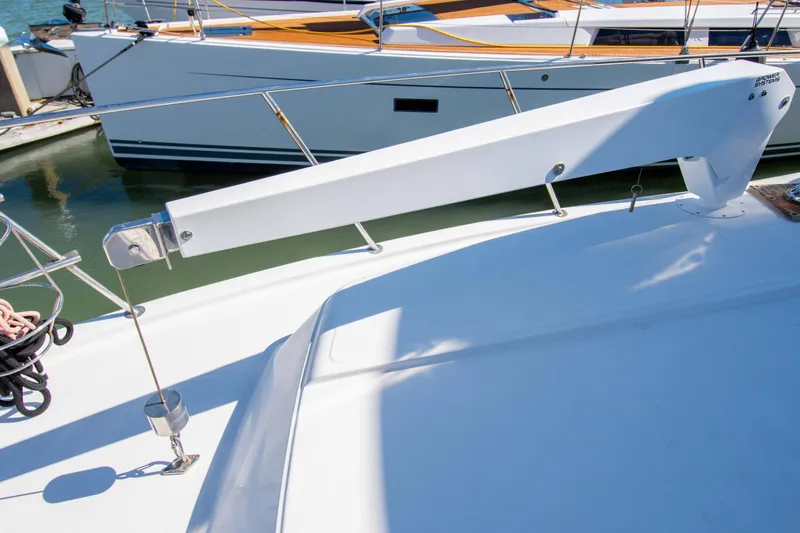 Slide: The Image of 1989 Chris-Craft Catalina boat deck with sleek white design and docked in marina. - 31