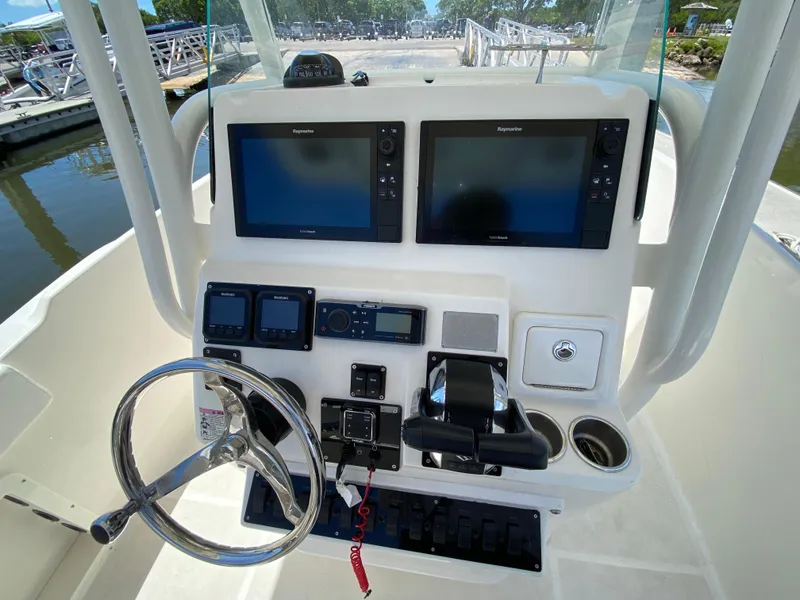 Slide: The Image of Century 2600 Center Console 2017 dashboard with dual Raymarine displays and controls. - 14