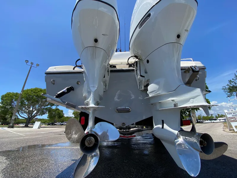 Slide: The Image of 2017 Century 2600 Center Console boat with dual outboard engines, viewed from the rear. - 20