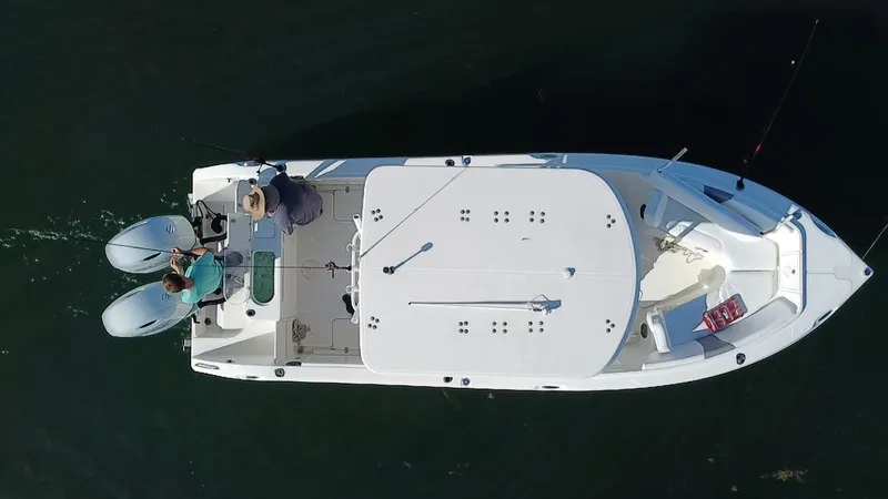 Slide: The Image of Overhead view of 2017 Century 2600 Center Console boat with two people fishing. - 22
