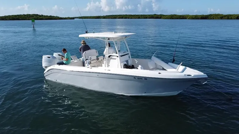 Slide: The Image of 2017 Century 2600 Center Console boat on calm water, two people fishing. - 3