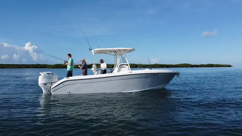 Slide: The Image of 2017 Century 2600 Center Console boat with anglers fishing on calm waters. - 4