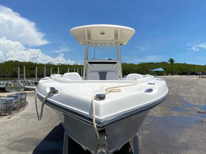 Slide: The Image of 2017 Century 2600 Center Console boat docked under clear blue sky. - 5