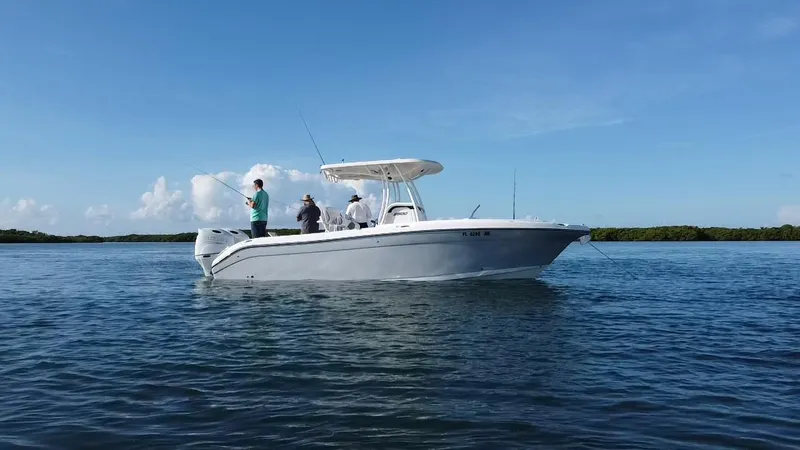 Slide: The Image of 2017 Century 2600 Center Console boat with people fishing on calm water. - 8
