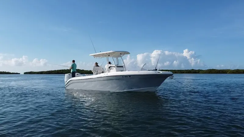 Slide: The Image of 2017 Century 2600 Center Console boat on calm water, two people fishing. - 9