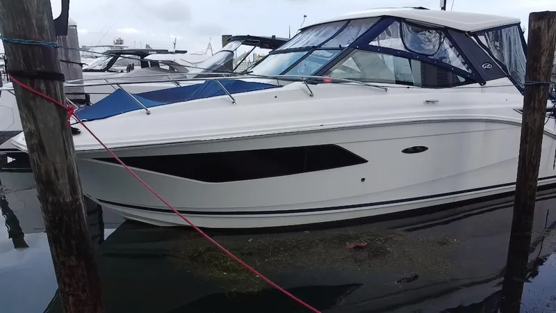 Slide: The Image of 2020 Sea Ray Sundancer 320 OB docked, featuring sleek design and modern amenities. - 1