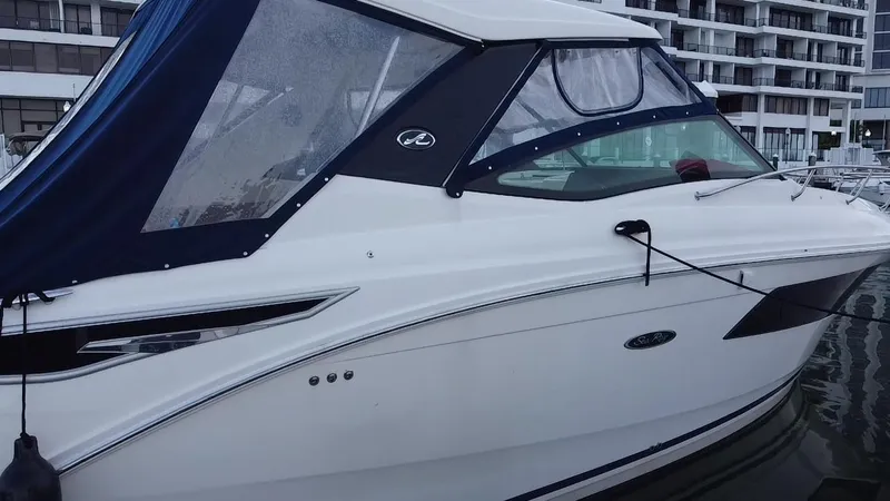 Slide: The Image of 2020 Sea Ray Sundancer 320 OB docked at marina, featuring sleek design and modern amenities. - 15