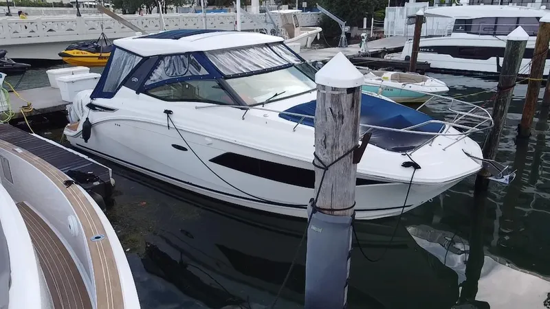 Slide: The Image of 2020 Sea Ray Sundancer 320 OB docked at marina, featuring sleek design and modern amenities. - 9