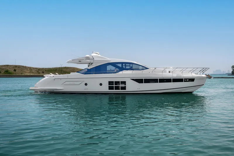 Slide: The Image of 2019 Azimut S7 yacht on calm water under clear blue sky. - 0