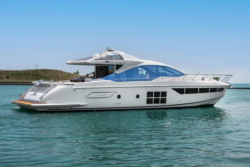 Slide: The Image of 2019 Azimut S7 yacht on calm water, showcasing sleek design and luxury features. - 1