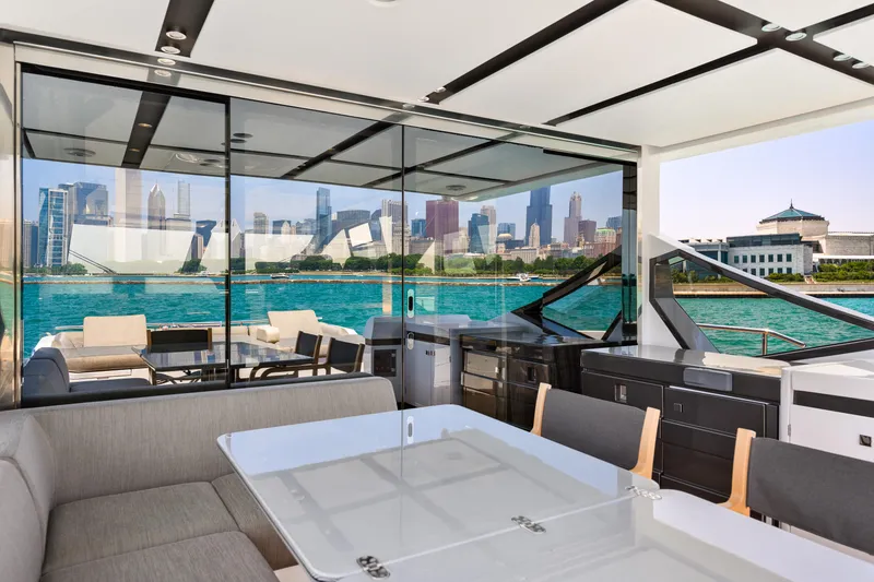 Slide: The Image of Luxurious 2019 Azimut S7 yacht interior with city skyline view through glass windows. - 13