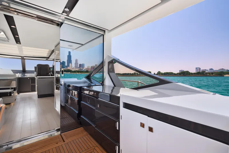 Slide: The Image of Luxurious 2019 Azimut S7 yacht interior with city skyline and waterfront view. - 19