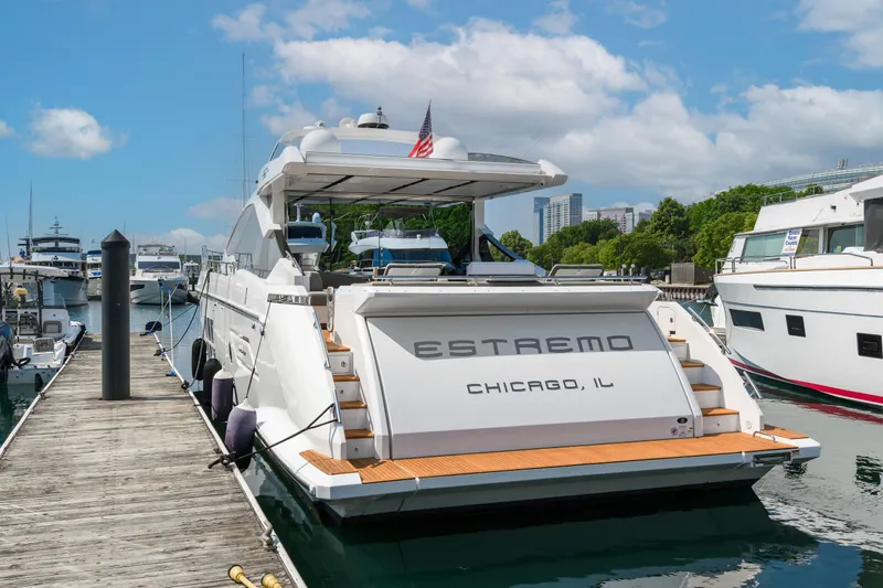 Slide: The Image of Azimut S7 2019 yacht "Estremo" docked in Chicago marina under a clear blue sky. - 3