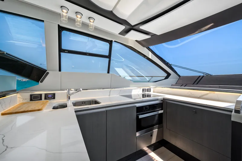 Slide: The Image of Luxurious kitchen interior of 2019 Azimut S7 yacht with modern design and panoramic windows. - 31