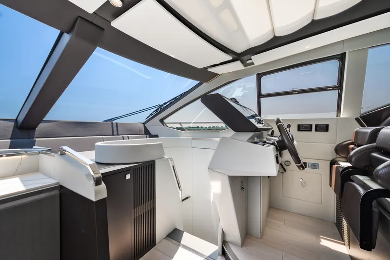Slide: The Image of Interior of 2019 Azimut S7 yacht, featuring modern helm and luxurious seating. - 33