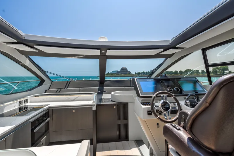 Slide: The Image of 2019 Azimut S7 yacht cockpit with modern controls and ocean view. - 35