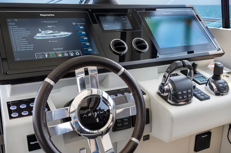 Slide: The Image of Cockpit of 2019 Azimut S7 yacht with advanced navigation controls and touchscreen displays. - 37