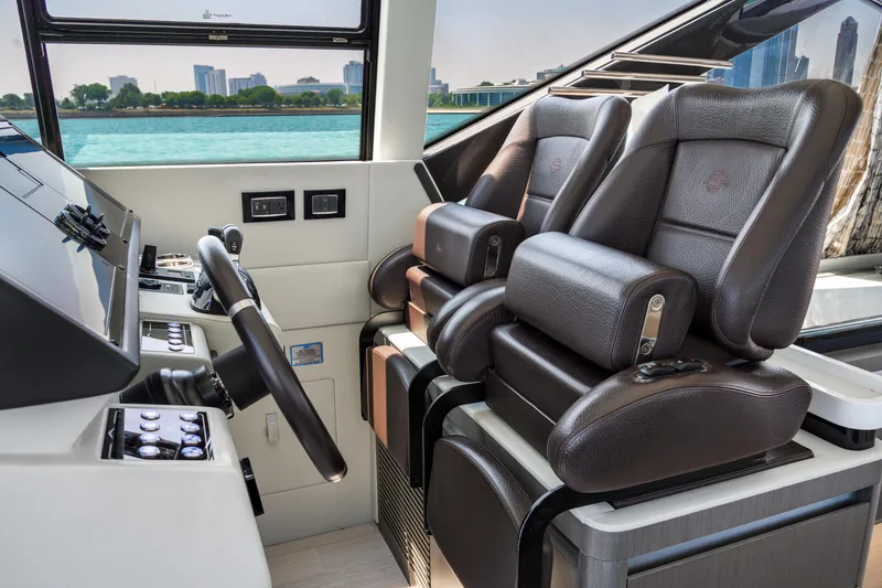 Slide: The Image of Interior of 2019 Azimut S7 yacht with luxurious leather seating and modern controls. - 38