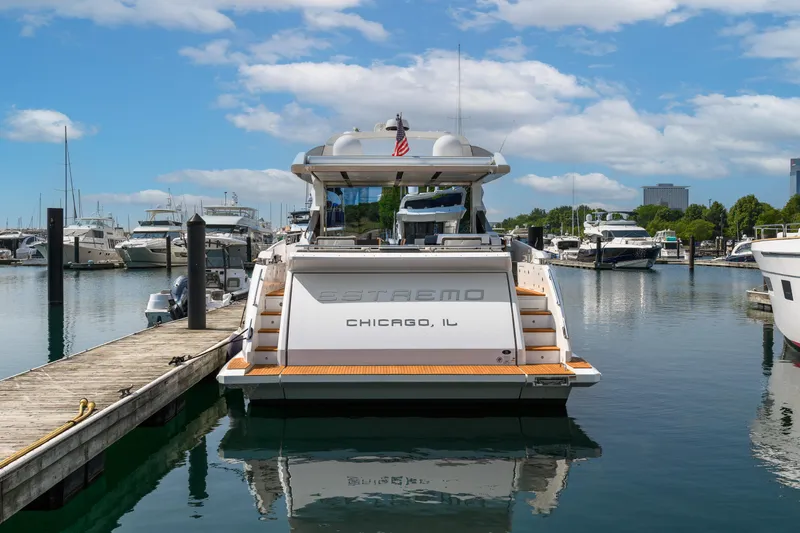 Slide: The Image of Azimut S7 2019 yacht docked in Chicago marina under a partly cloudy sky. - 4