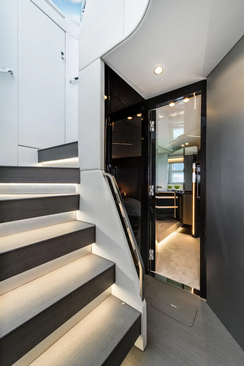 Slide: The Image of Interior of 2019 Azimut S7 yacht featuring modern staircase and sleek design. - 40
