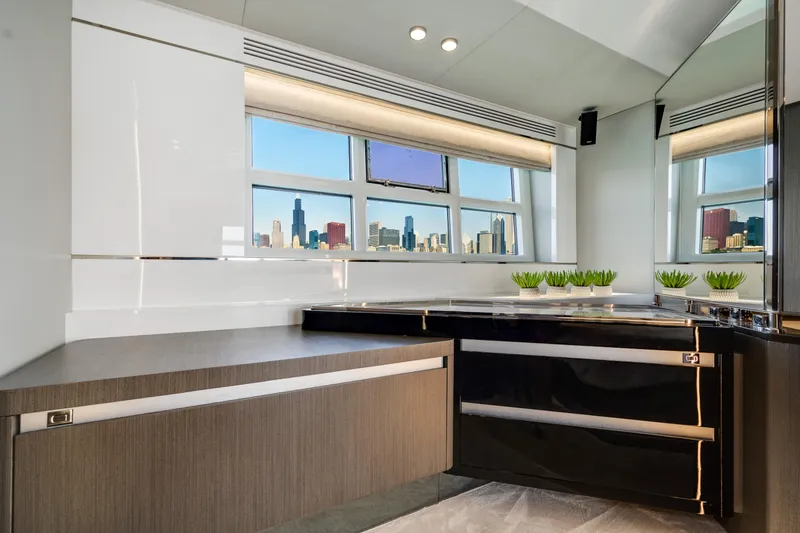 Slide: The Image of Luxurious interior of 2019 Azimut S7 yacht with city skyline view through large windows. - 43