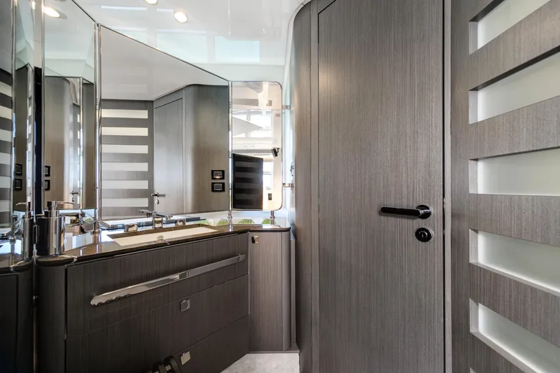 Slide: The Image of Luxurious bathroom interior of 2019 Azimut S7 yacht with modern wood finishes and sleek design. - 44