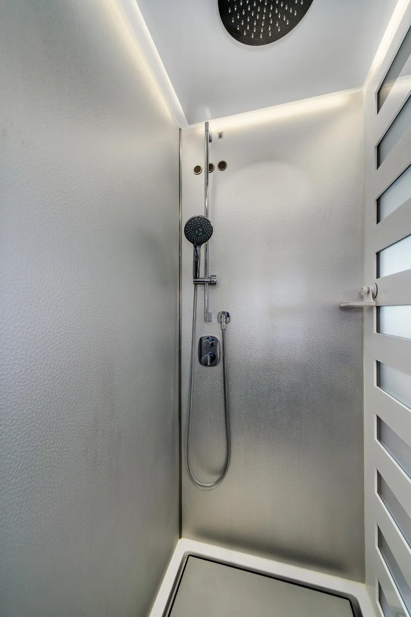 Slide: The Image of Modern shower in 2019 Azimut S7 yacht with sleek design and overhead rain showerhead. - 46