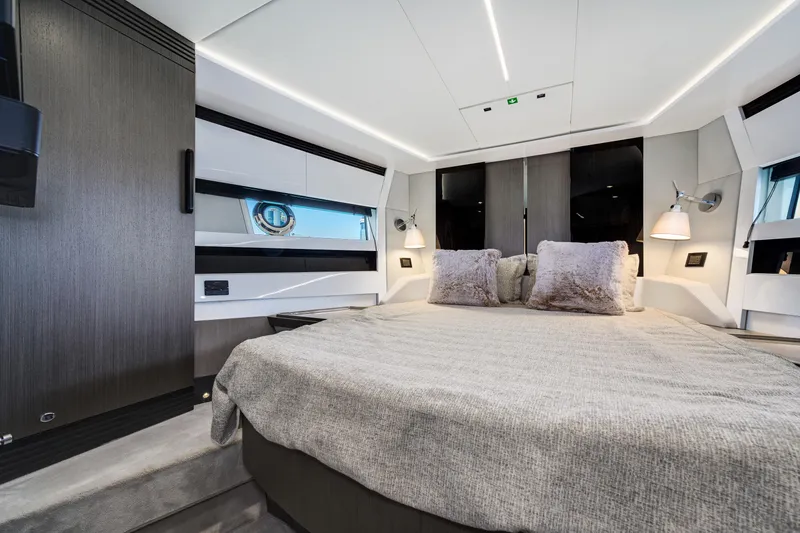Slide: The Image of Luxurious bedroom interior of 2019 Azimut S7 yacht with modern design and cozy bedding. - 49