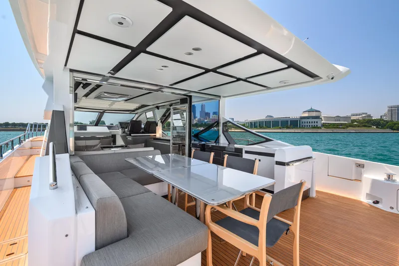Slide: The Image of Luxurious 2019 Azimut S7 yacht with spacious deck and modern seating by the water. - 8