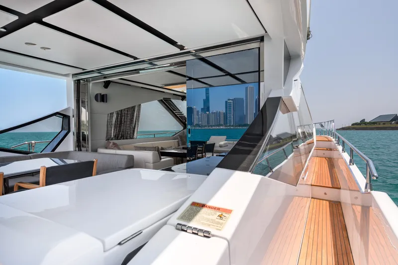 Slide: The Image of 2019 Azimut S7 yacht with luxurious interior and scenic ocean view. - 9