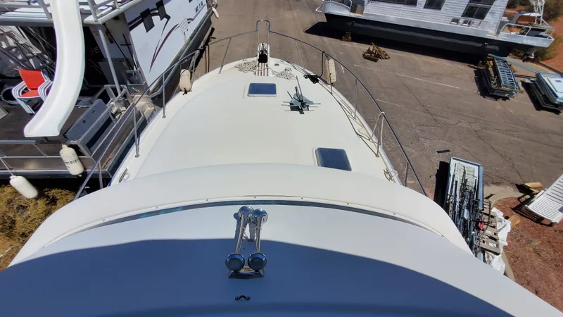 Slide: The Image of 1985 Silverton 40 Aft Cabin boat deck view, docked with surrounding vessels. - 20