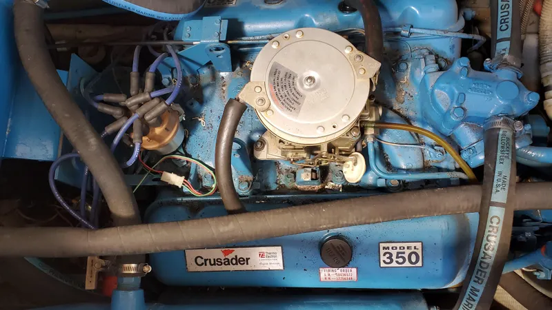 Slide: The Image of 1985 Silverton 40 Aft Cabin engine, Crusader Model 350, blue components and wiring visible. - 21