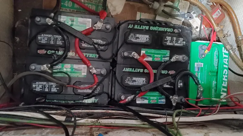 Slide: The Image of Battery setup in a 1985 Silverton 40 Aft Cabin boat engine room. - 25